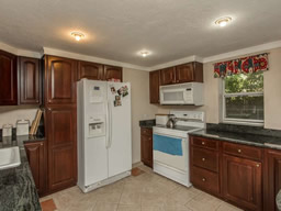 The kitchen features granite counters.