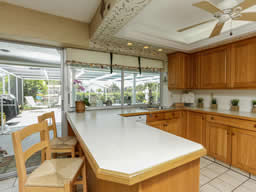 The centrally located kitchen is well-designed