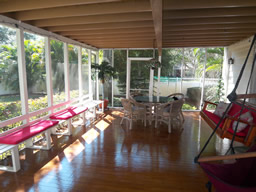 Relax and enjoy this wide, shady screened porch.
