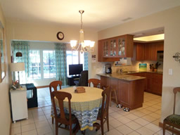 The dining room is adjacent to the kitchen
