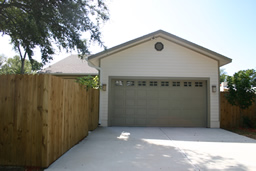 The garage is accessed from the alley running behind the home.