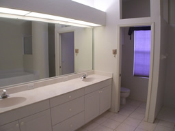 The bath has a wide vanity with double sinks