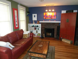 The living room focuses on the fireplace.