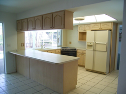 The Updated Kitchen has new cabinets and tile flooring