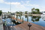 The dock has electric and water service and can accommodate several boats
